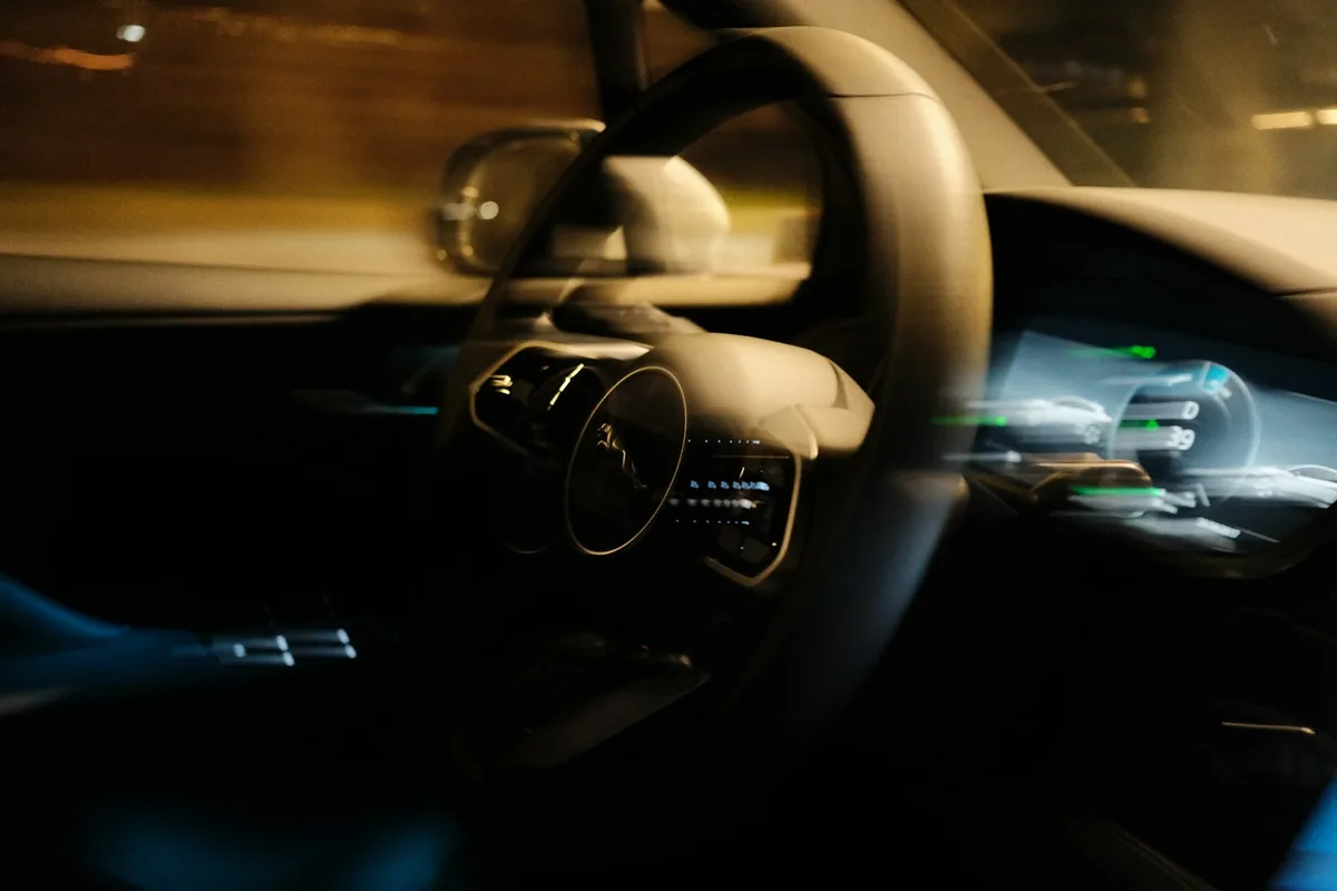 Close-up view of a car on the road representing vehicle insurance