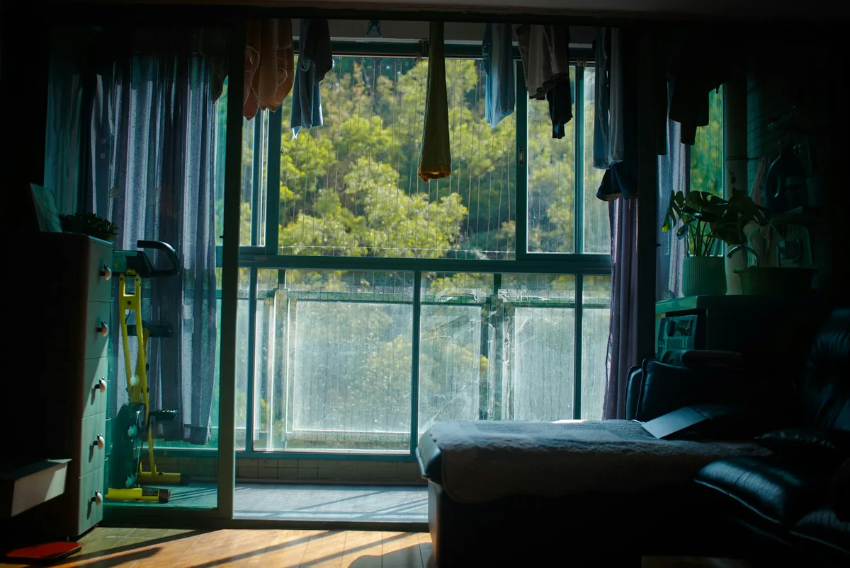A modern Australian rental apartment interior showing personal belongings and furniture