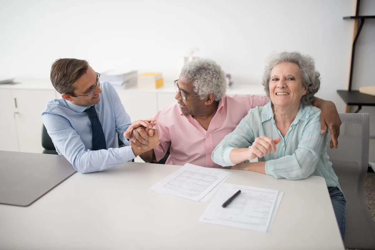 Family sitting together discussing financial planning and life insurance protection