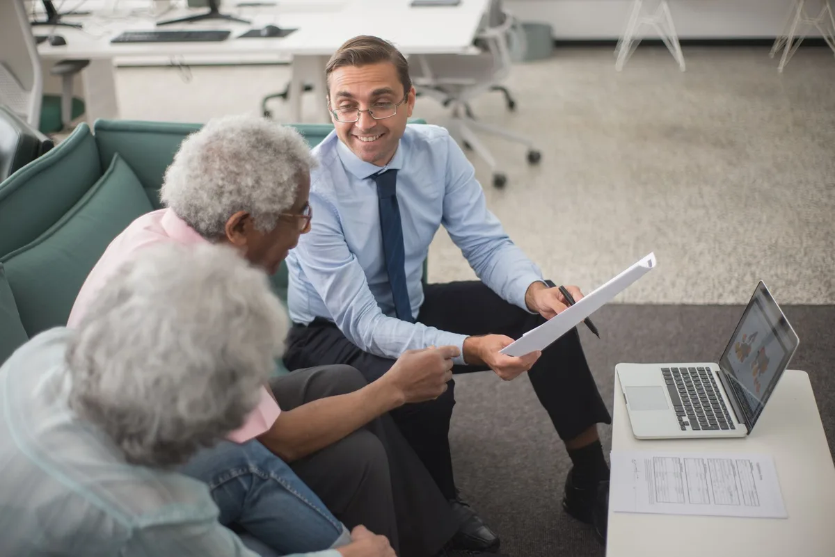 Person reviewing financial documents and insurance paperwork