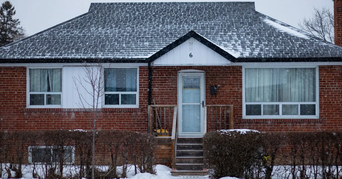Calculator on insurance documents representing rising home insurance premium calculations in Canada