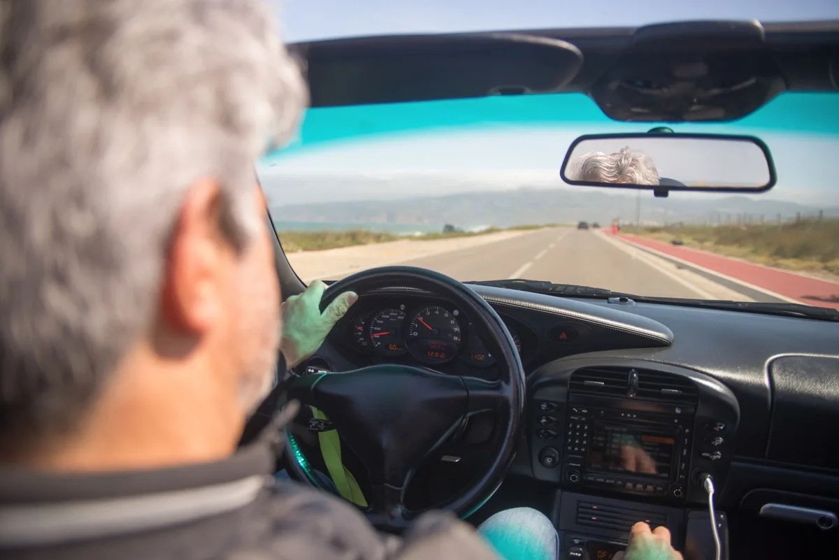 Driver behind the wheel on an Ontario road