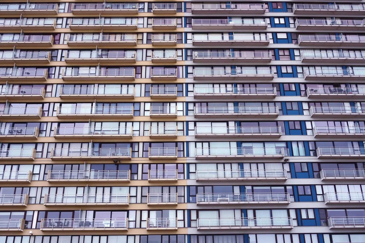 Modern condominium building with glass balconies