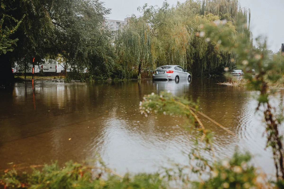 Flooded residential street with rising water after a severe storm