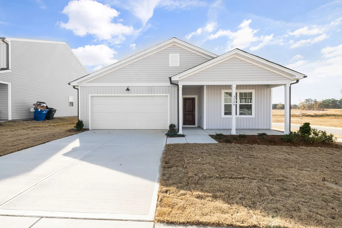 Single family Canadian home exterior with well-maintained front yard