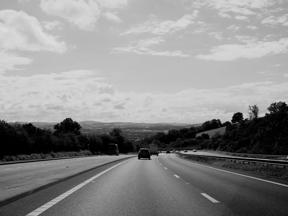 Car on road representing claims-free driving