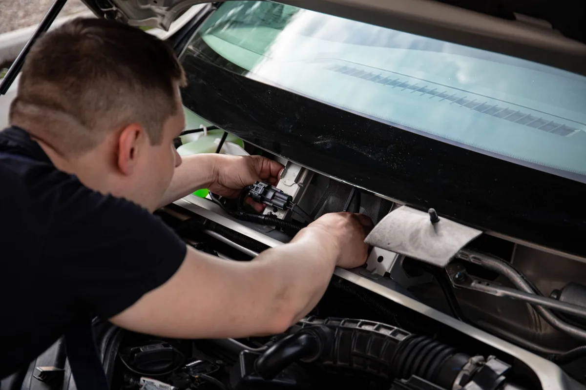 Car insurance concept with vehicle and documentation