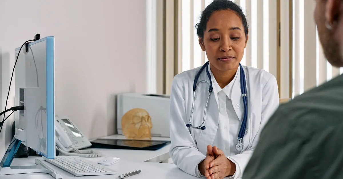 A stethoscope and medical documents on a desk.