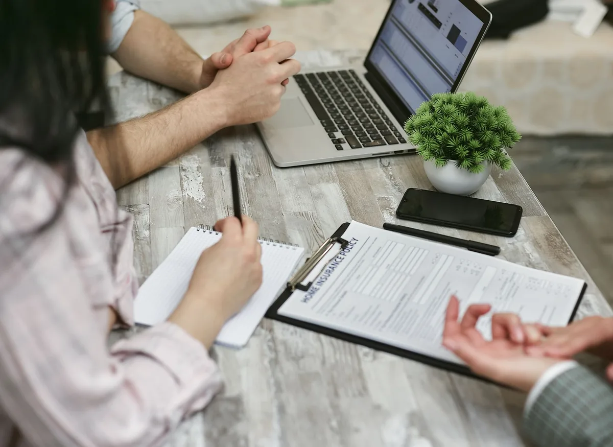 Business professionals in discussion about corporate insurance planning