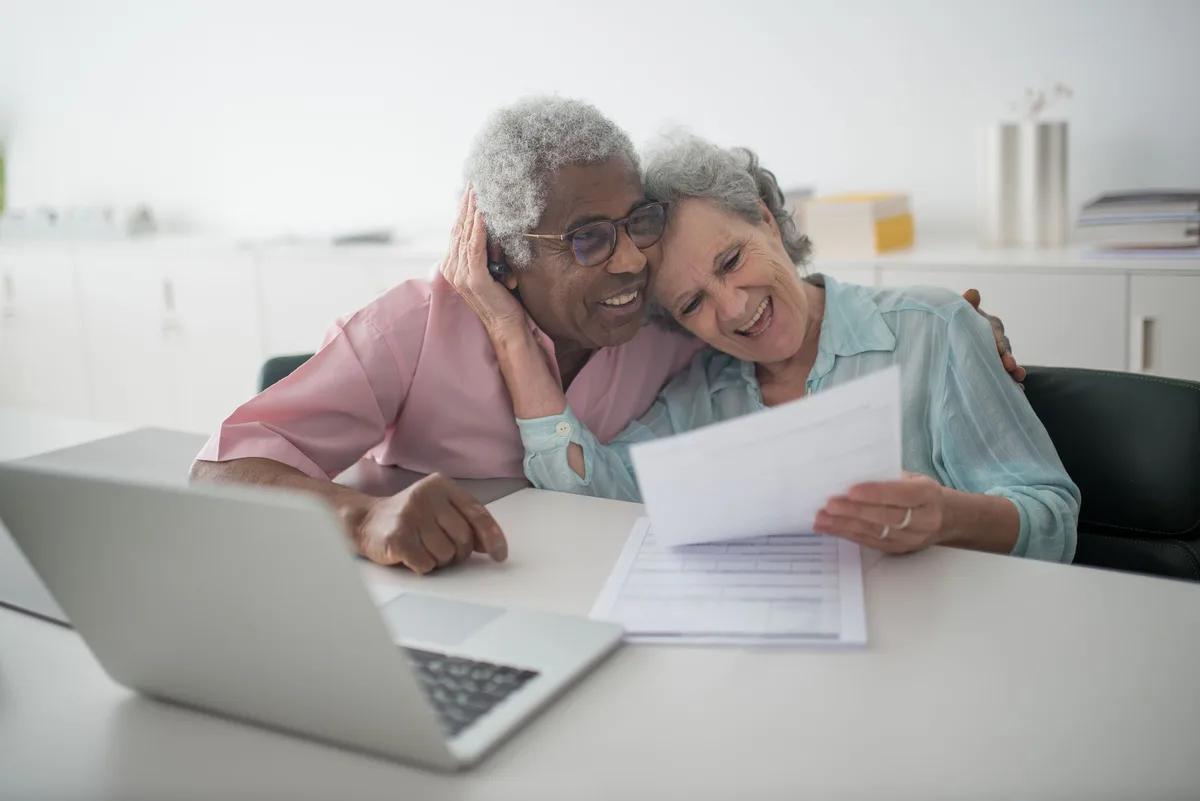 Family reviewing financial documents together at home
