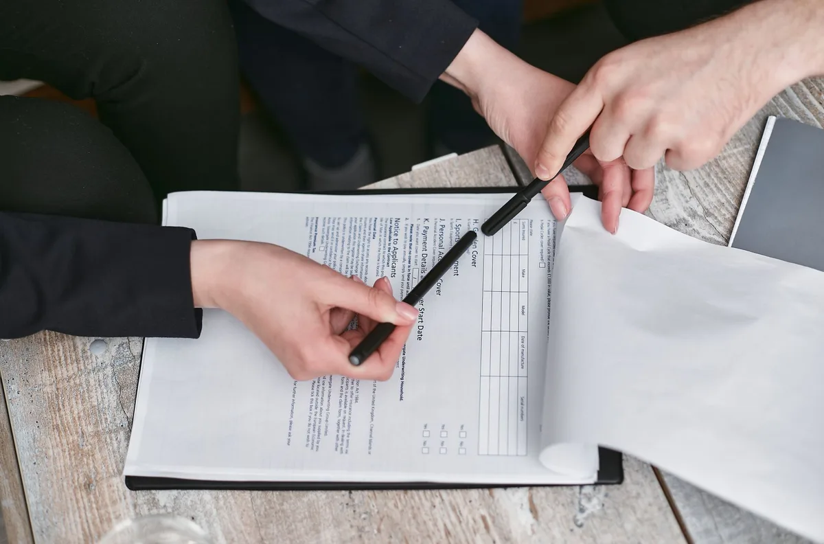 Insurance documents with pen on desk representing appraisal documentation