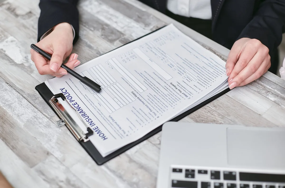 Family reviewing life insurance documents together at home