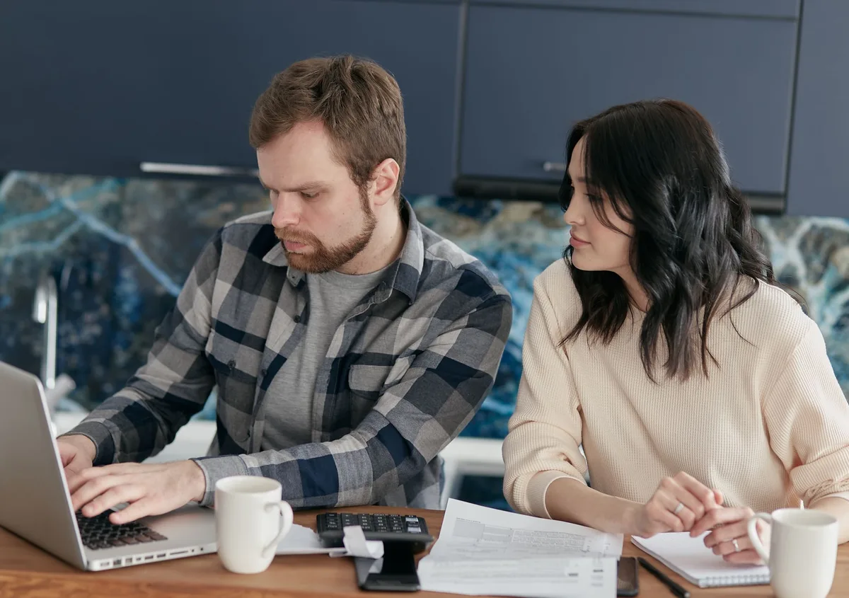 A family sitting together at home discussing financial planning
