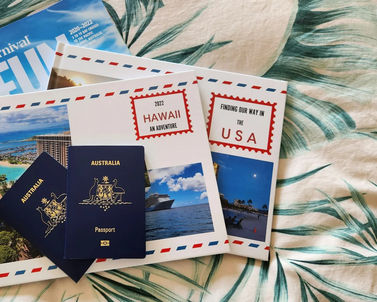Travel insurance documents and planning paperwork with pen