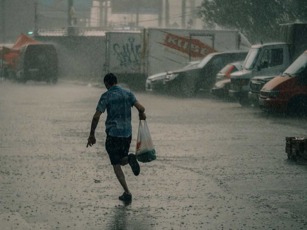 Floodwater flowing through an urban area during a storm event