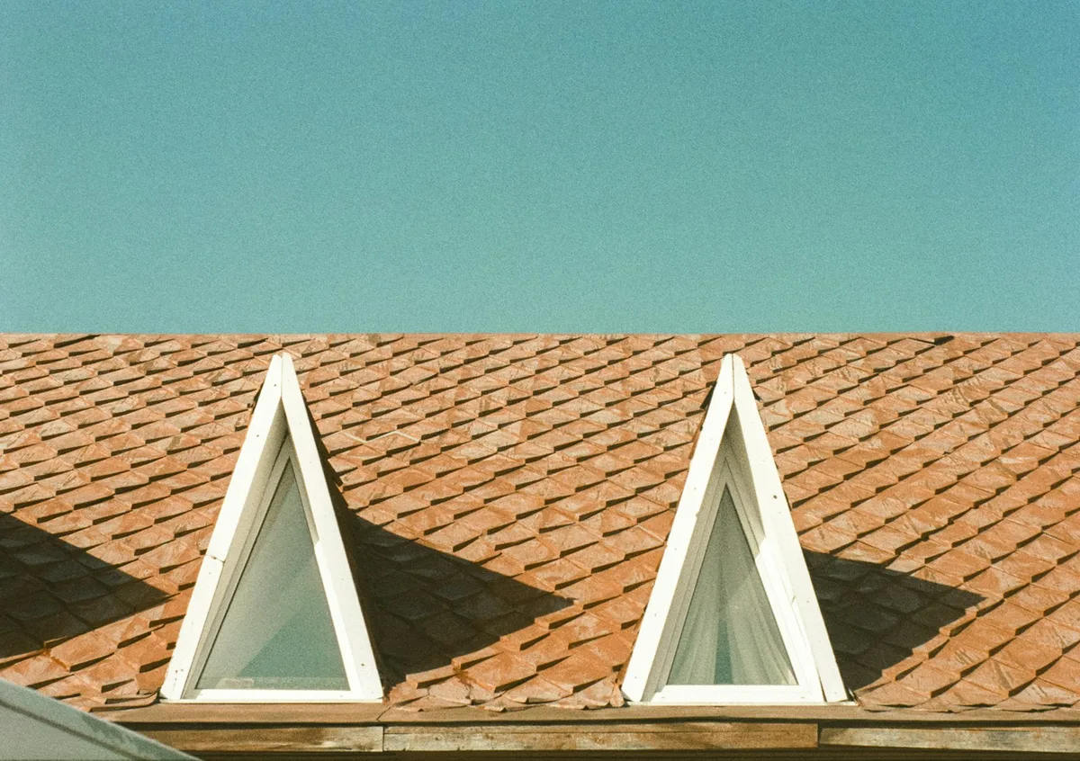 Residential home exterior showing structure, roof, and windows