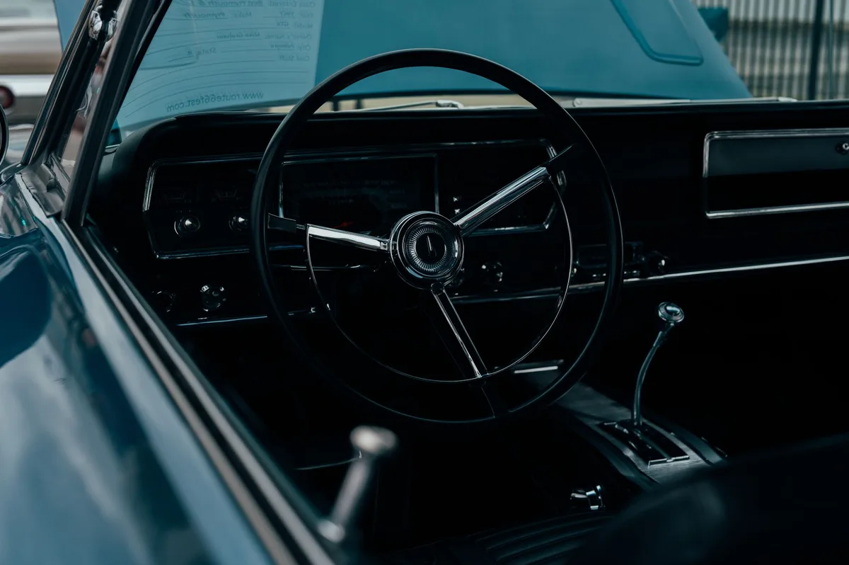 Close-up of a car steering wheel and dashboard representing auto insurance coverage