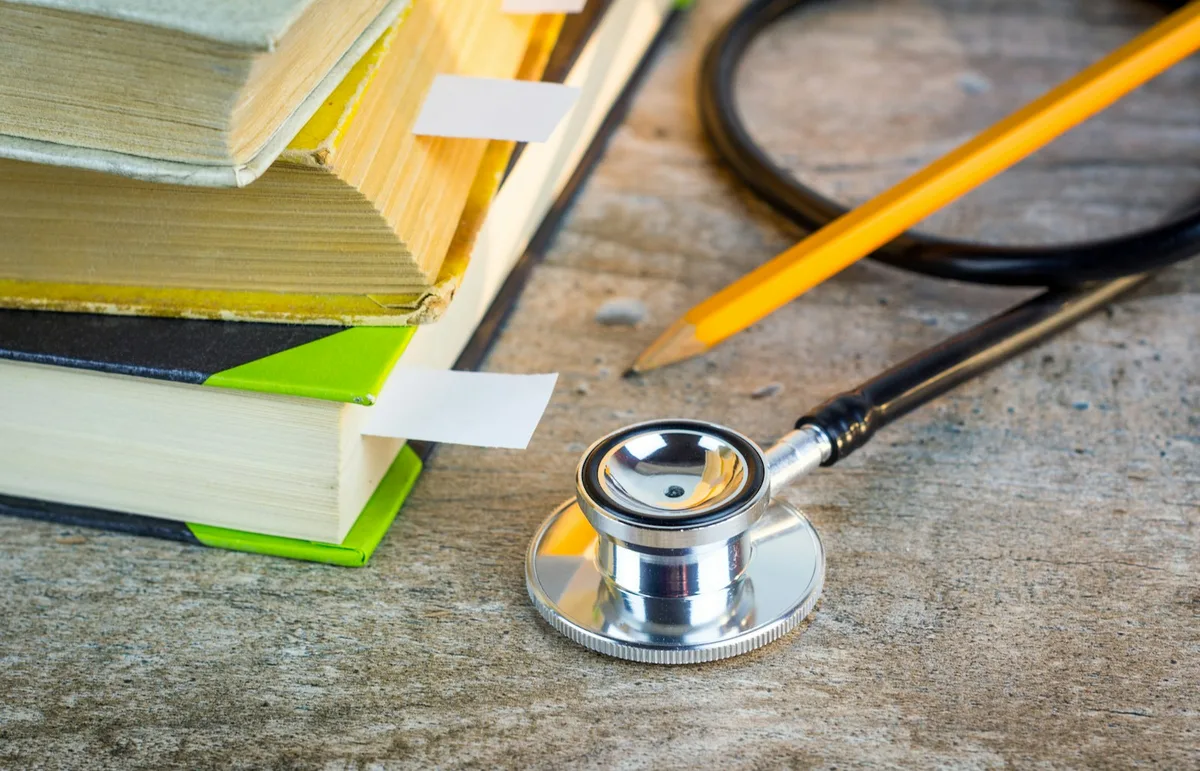 Medical stethoscope and health documents representing critical illness insurance