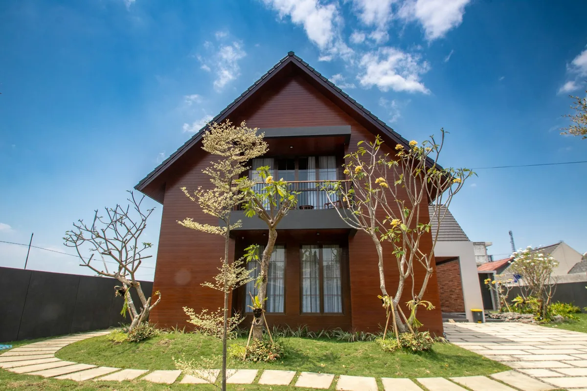 Modern UK house exterior with well-maintained garden and front entrance