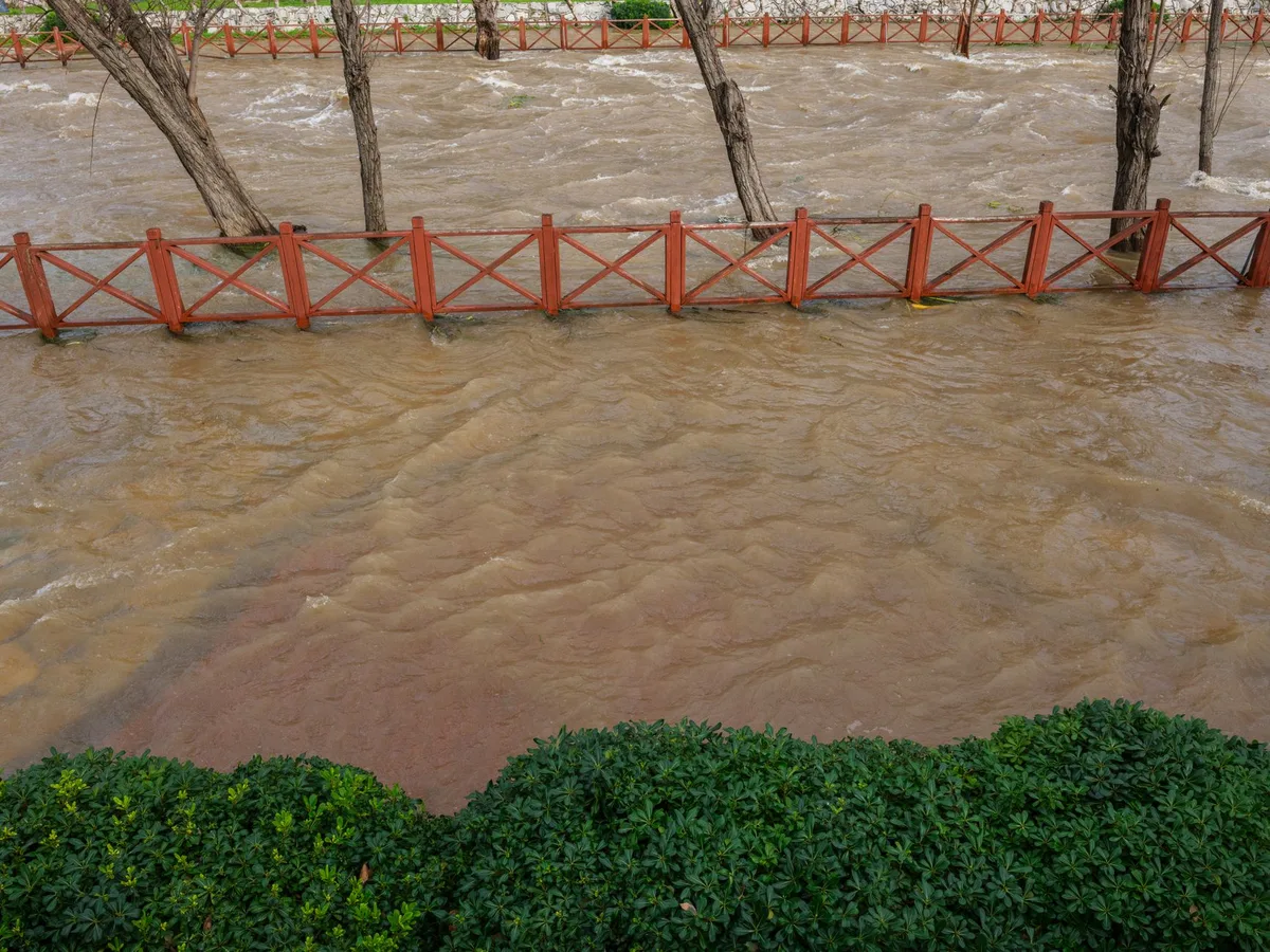 Flooded street with standing water after heavy rainfall