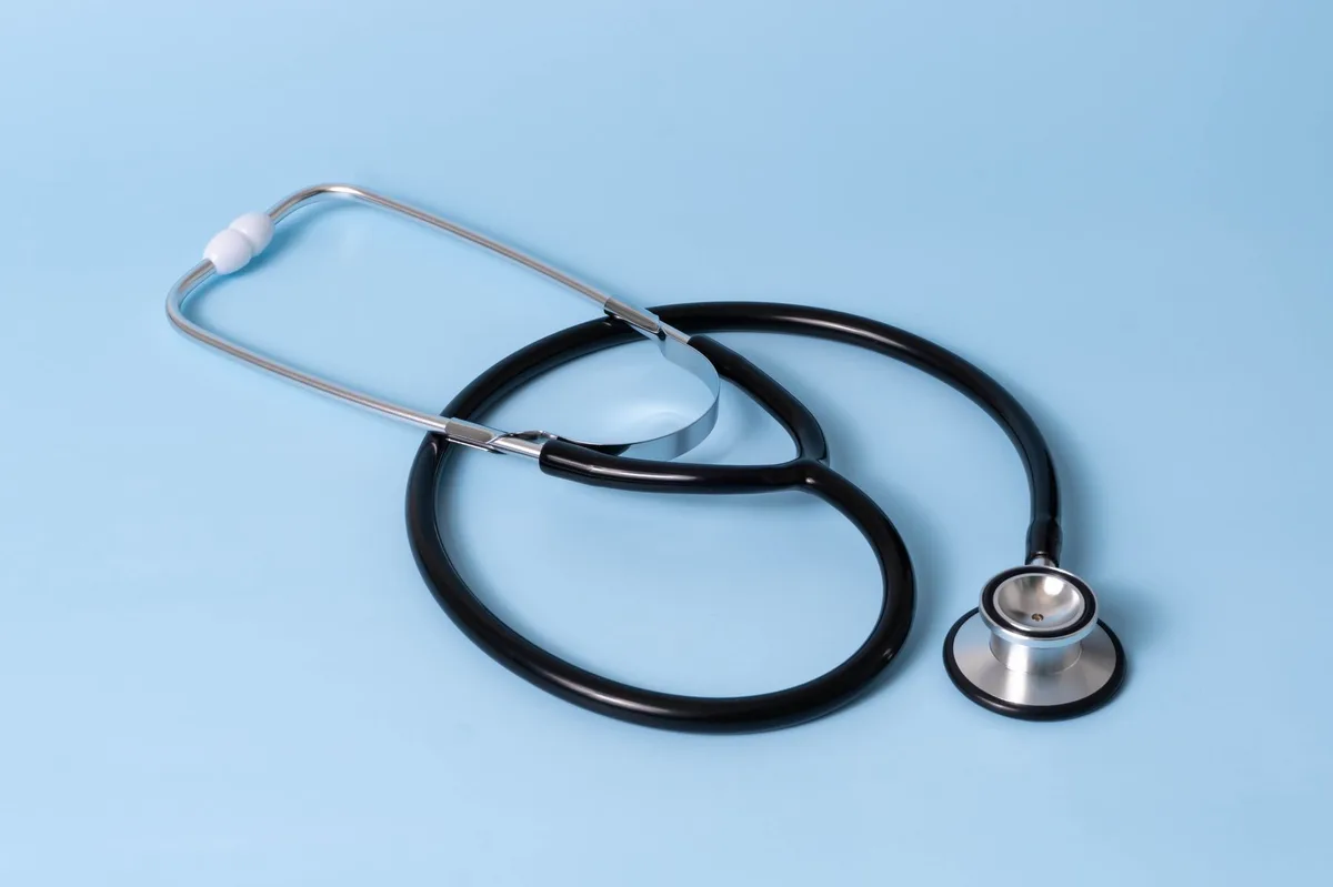 A stethoscope and medical documents representing health insurance planning