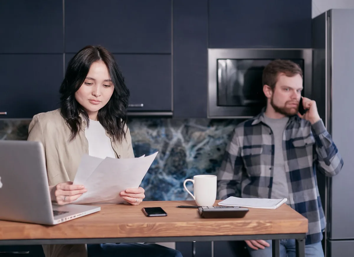 Family discussing finances together at home