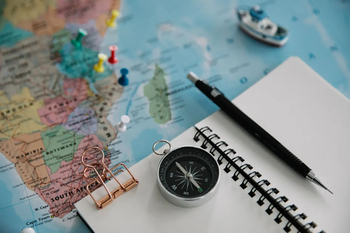 Notebook and pen on desk for travel planning