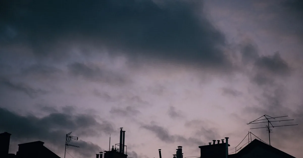 Detached house exterior under a cloudy sky