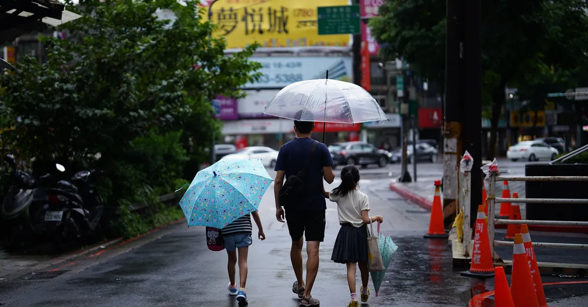 A family sitting together at home, representing life insurance and household protection planning