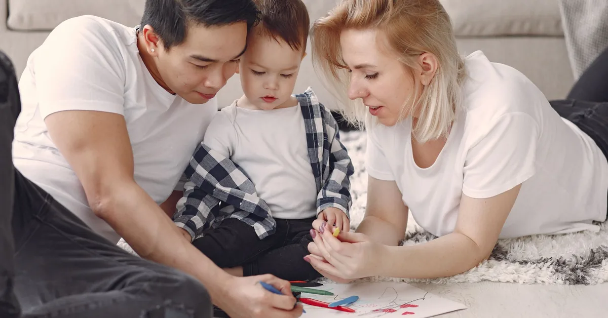 A family sitting together at home, representing financial protection for dependants.