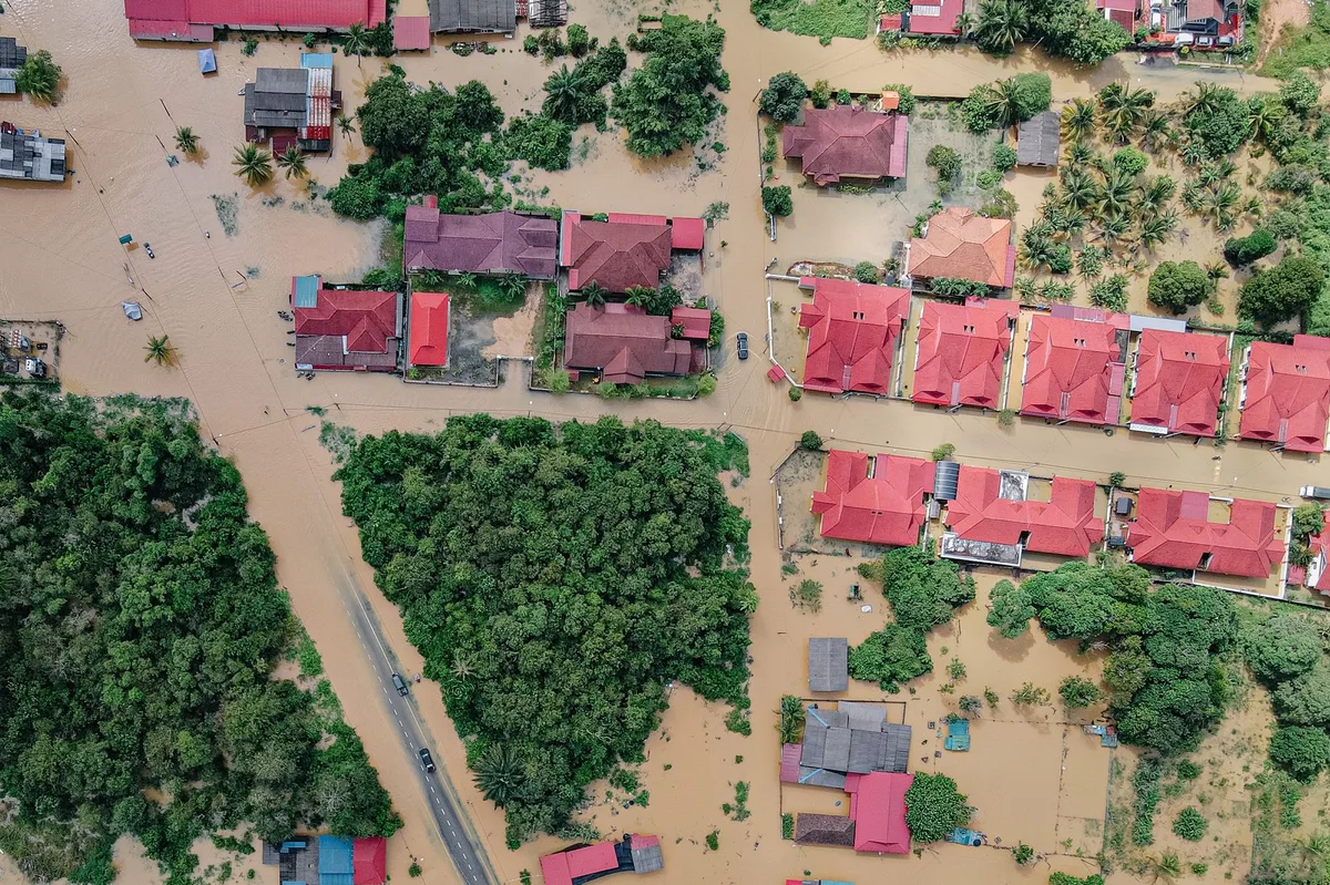 Flooded residential area with water covering the street and surrounding properties