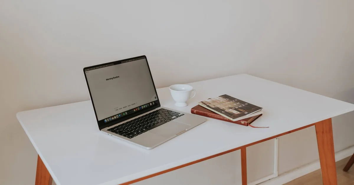 Person reviewing business insurance documents at home office desk