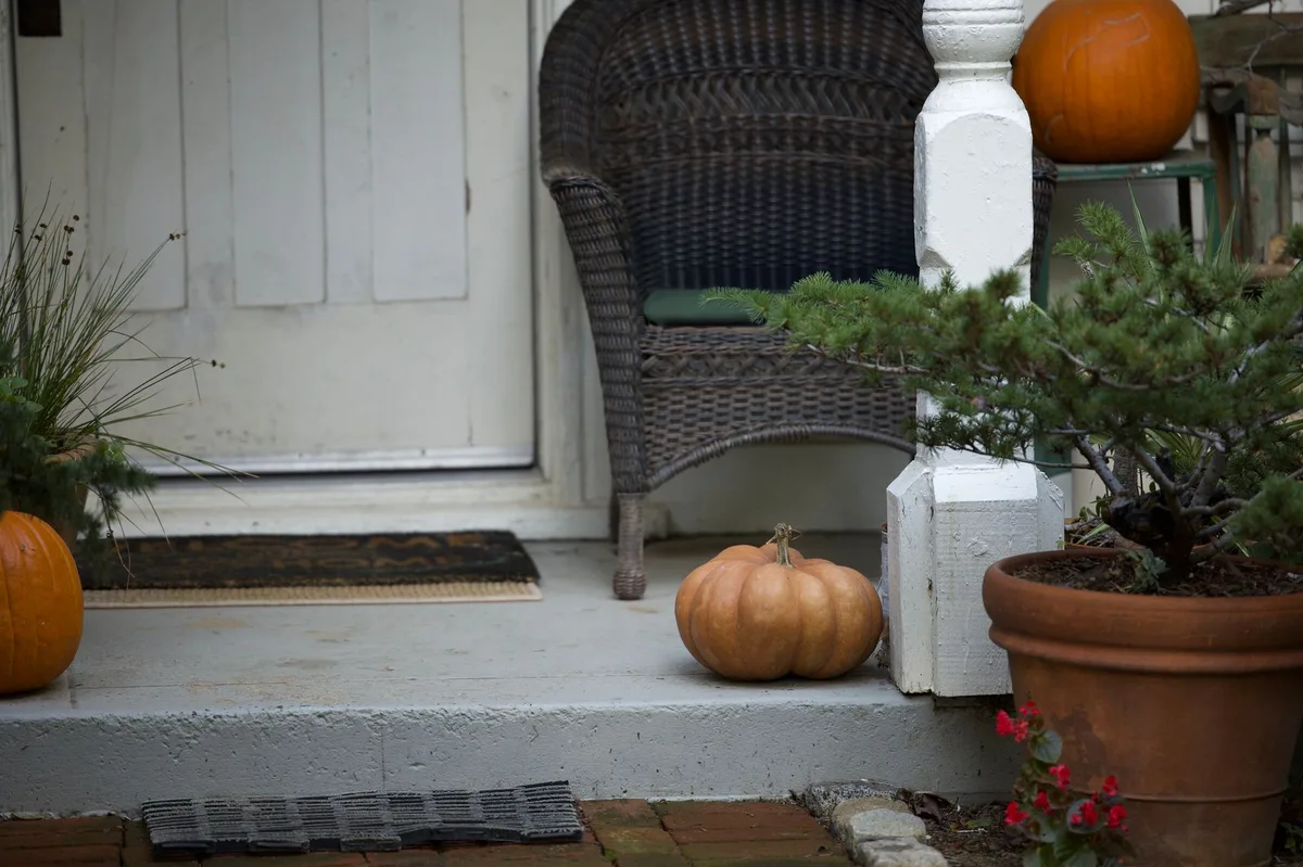 Residential home exterior with front entrance and landscaping