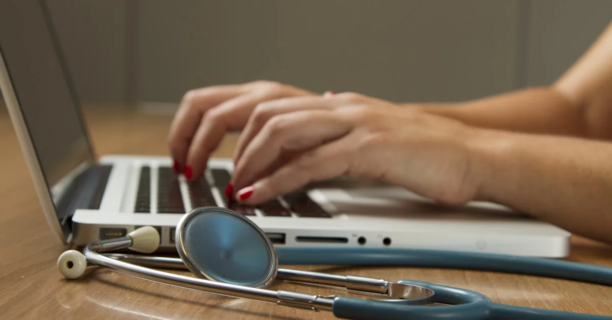 Medical stethoscope and health documents representing health insurance planning