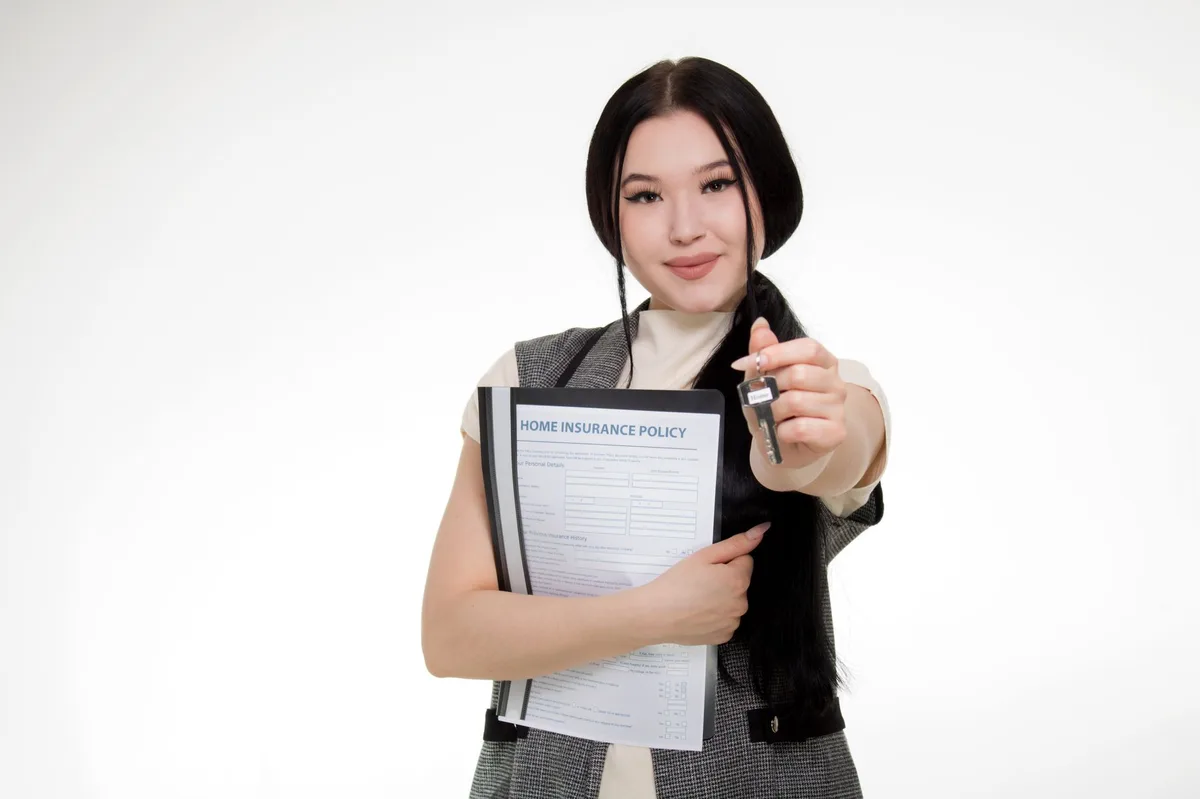 Close-up view of car insurance documents and vehicle keys