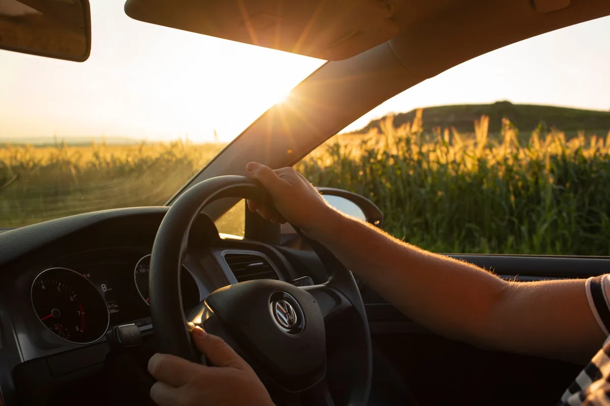 Driver behind the wheel on a sunny day