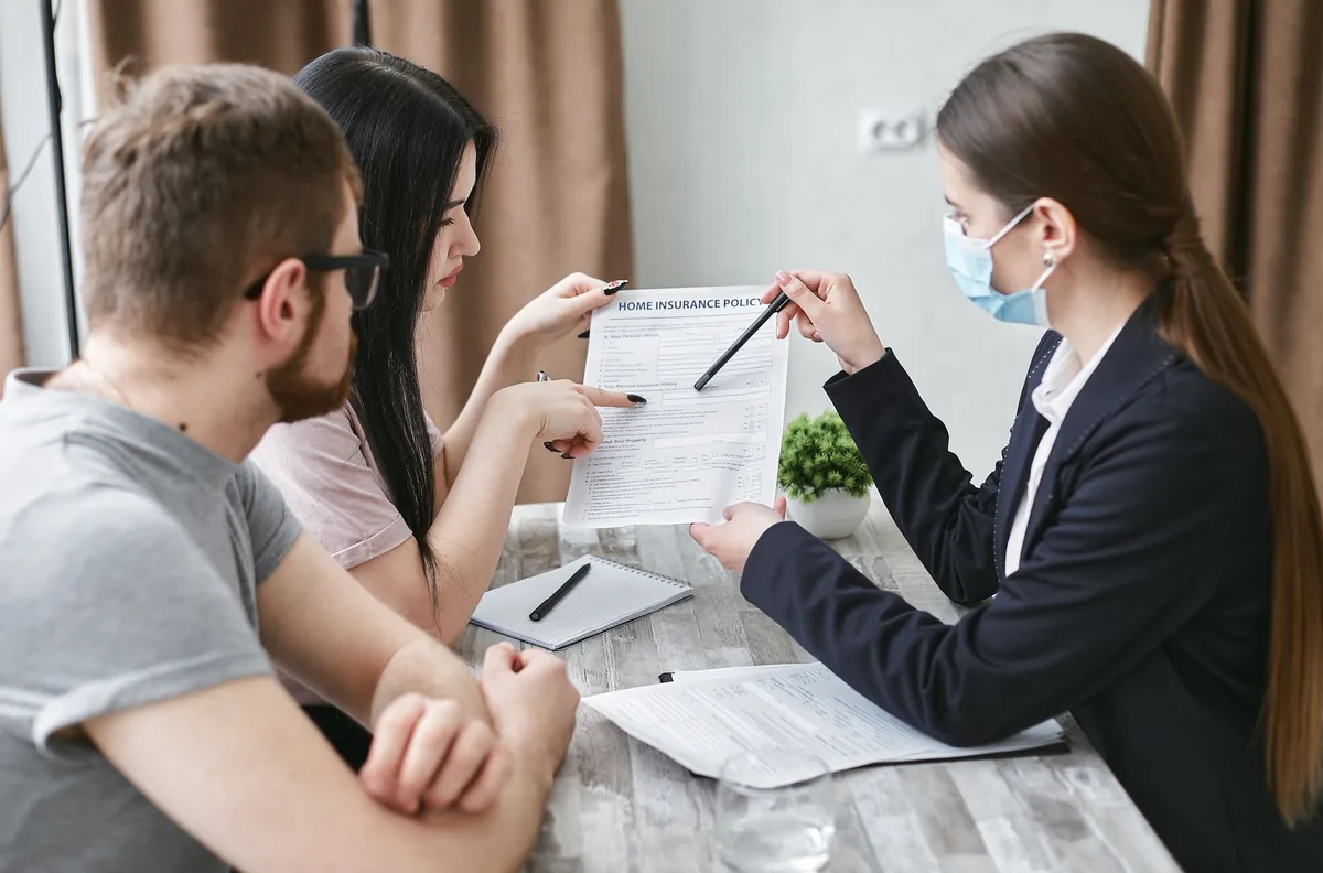 Family reviewing life insurance documents together at home