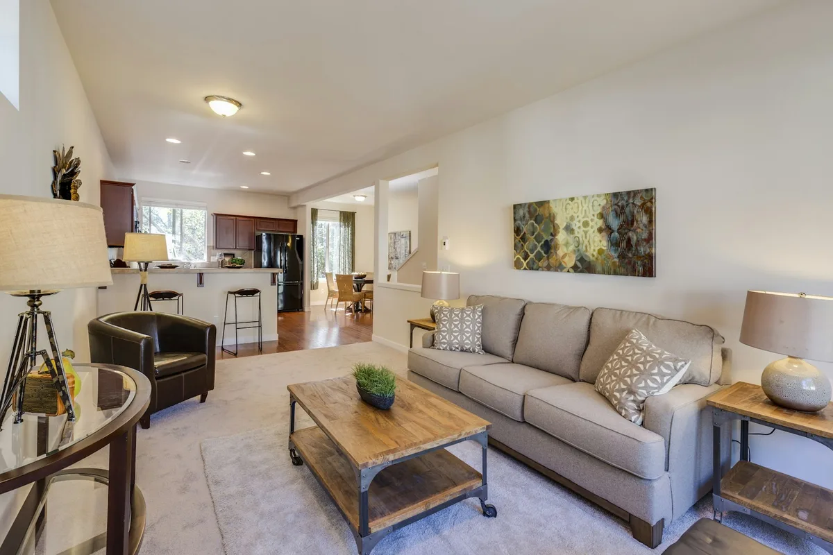 Modern furnished apartment interior showing personal belongings and rental living space
